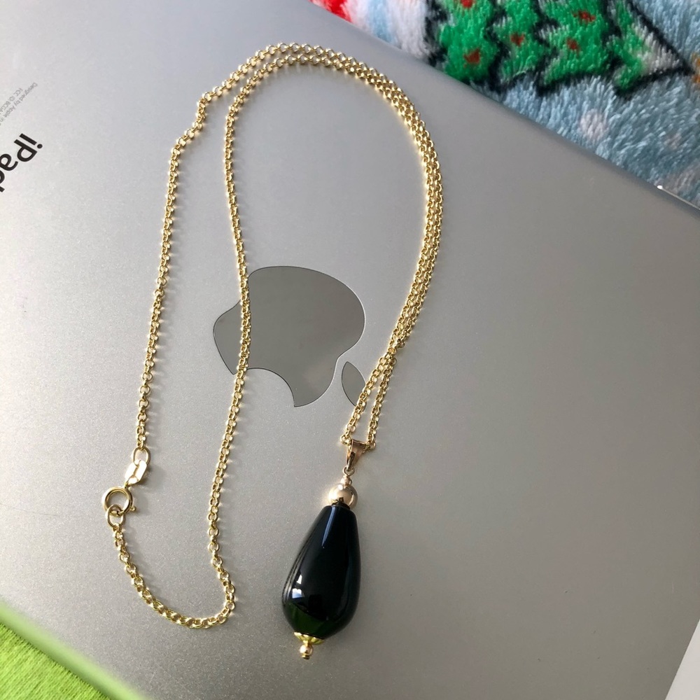 Solid 14k gold 18” chain with onyx pendant.